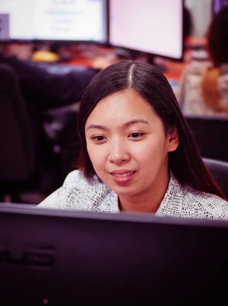 Creative team member working at a computer