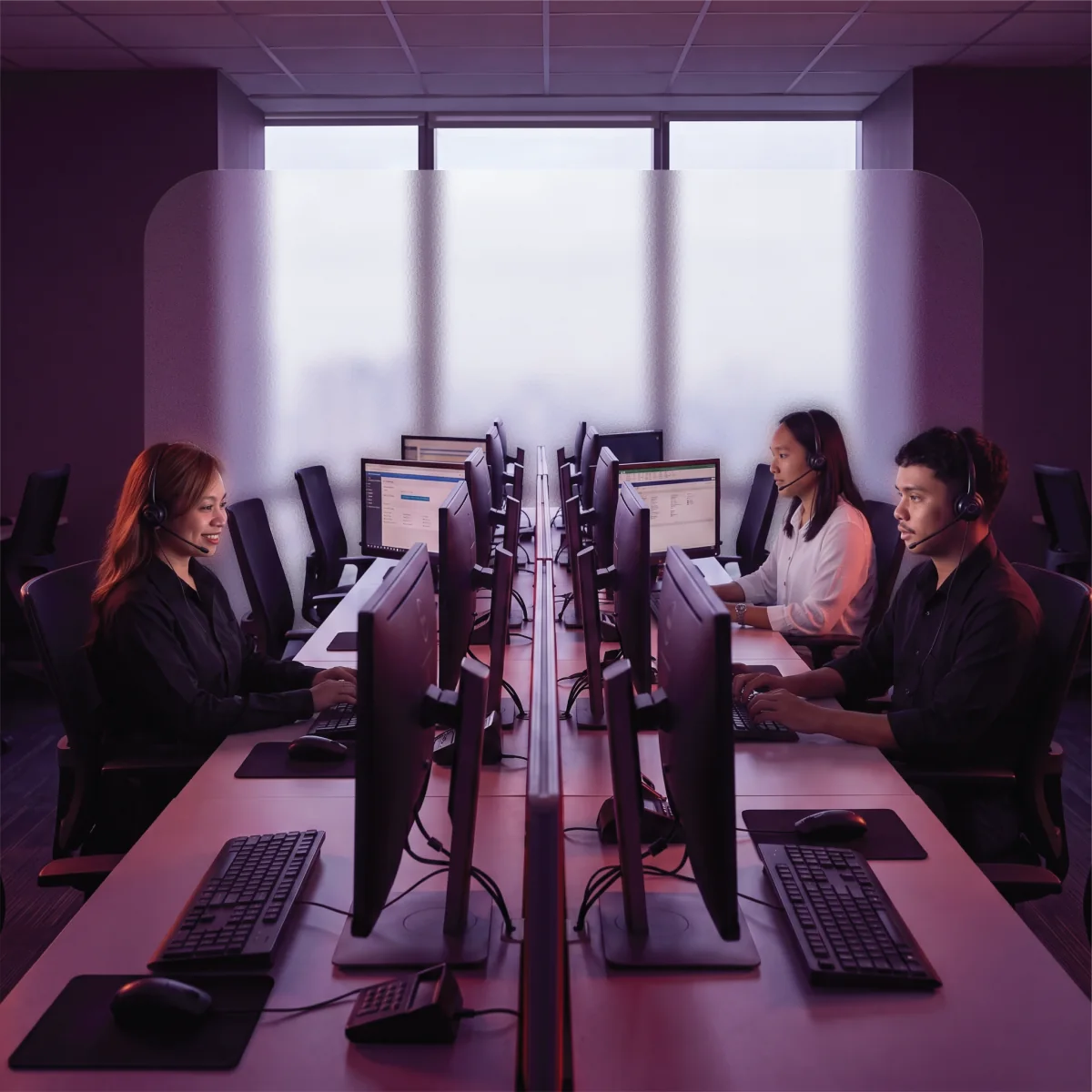 Offshore staffing team standing together in an office